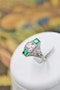An extraordinarily stylish and finely made Platinum "Art Deco" 1.00 Carat Diamond & two "Square Cut" Emerald Ring, Circa 1935 - image 2