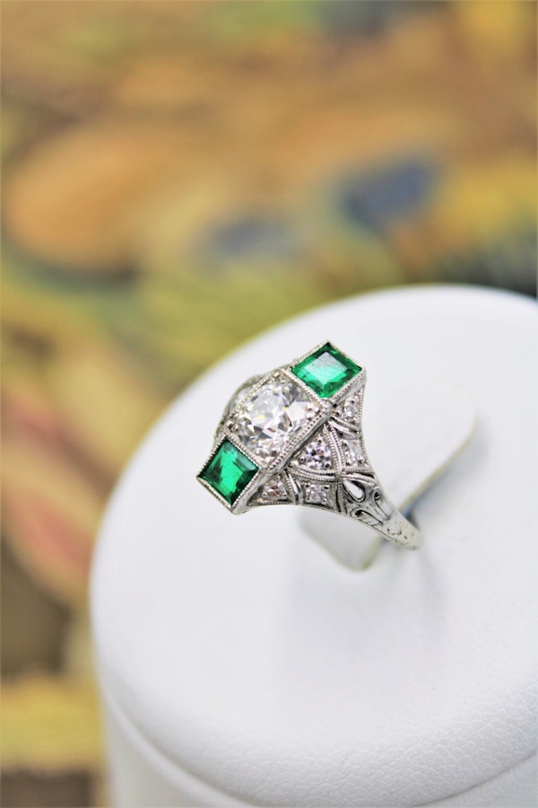 An extraordinarily stylish and finely made Platinum "Art Deco" 1.00 Carat Diamond & two "Square Cut" Emerald Ring, Circa 1935 - image 2