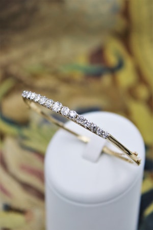 Downstairs at Grays, an exceptionally fine Antique Graduated Diamond Bangle mounted in 15ct Yellow Gold (tested), Circa 1890 - 1905.