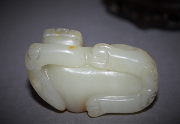 A Chinese jade carving of a lion dog. - image 4