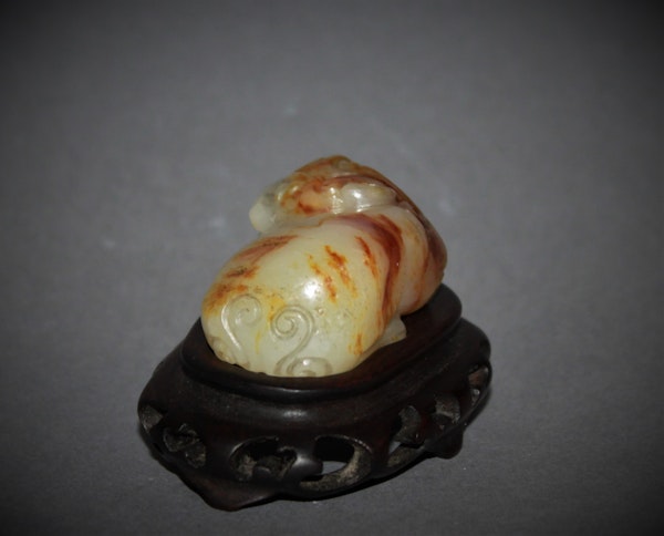 A Chinese jade carving of a lion dog. - image 2