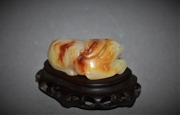 A Chinese jade carving of a lion dog. - image 3