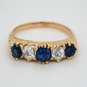 5 stone carved half hoop sapphire and diamond ring