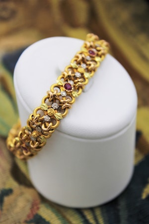 A very fine 18 Carat Green, Yellow and Pink Gold (French marked) Ruby set bracelet, French, Circa 1935