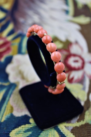 Downstairs at Grays: An exquisite Antique Coral Bangle with double hinge in High Carat Yellow Gold, Circa 1910