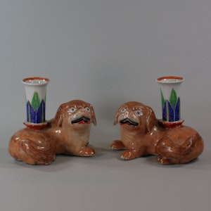 Pair of Chinese famille rose recumbent pug dog candle holders, Jiaqing (1796-1820)