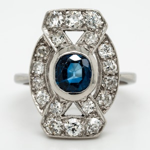 Diamond and sapphire tablet along the finger cluster ring