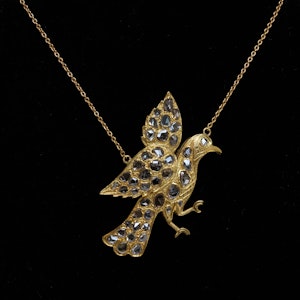 Rose cut diamond pendant of a bird