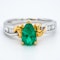 Pear shaped emerald and diamond baguette shoulders contemporary ring - image 1
