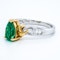 Pear shaped emerald and diamond baguette shoulders contemporary ring - image 3