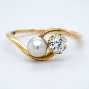 Antique natural pearl and diamond crossover ring