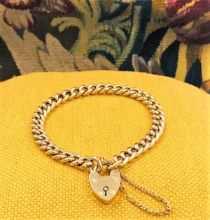 A very fine 18 Carat Yellow Gold (marked) Curb Link Bracelet with a Heart Shaped Padlock Closure. English,  Circa 1890
