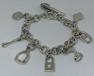 Hermes silver charm bracelet with charms that are from their iconic collections