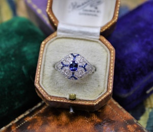 An "Art Deco Style" Sapphire & Diamond Demi-Bombe Ring mounted in Platinum, Mid-late 20th Century