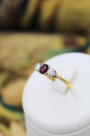 Downstairs at Grays: A very fine Three Stone Ruby & Diamond Engagement Ring mounted in 18ct Yellow Gold & Platinum, Circa 1950