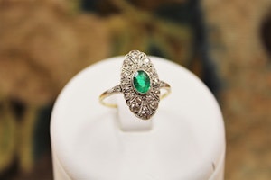 A very fine Oval Emerald & Diamond Plaque Ring mounted in 14ct Yellow Gold & Platinum, Continental, Circa 1920