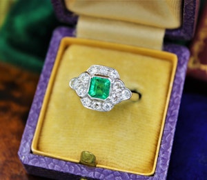 Downstairs at Grays: A very fine Emerald and Diamond Cluster Engagement Ring mounted in 18ct White Gold, English, Circa 1955