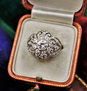 Downstairs at Grays: A very beautiful & stylish Art Deco Diamond Demi-Bombé Ring, mounted in Platinum, Circa 1935