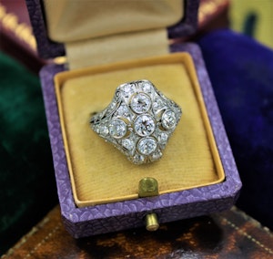 Downstairs at Grays: A very fine Art Deco Diamond Dress Ring mounted in Platinum and 14ct Gold, Circa 1930