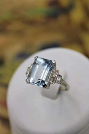 A very beautiful Platinum (marked) Aquamarine of approximately 8 Carats and Diamond stepped shouldered Ring, Mid 20th Century.
