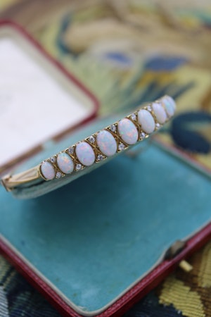 Downstairs at Grays, a very fine Graduated Antique Opal and Diamond Bangle set in 15ct Yellow Gold, English, Circa 1905