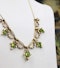An exquisite Peridot & Seed Pearl Festoon La Belle Époque Necklace with a matching Quatrefoil style detachable Pendant/Brooch in 15 Carat Yellow Gold, English, Circa 1900 - image 3