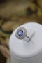 A fine Platinum Oval Ceylon Sapphire & Double Diamond Cluster Engagement Ring, Circa 1940.. - image 1