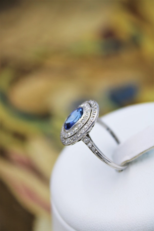 A fine Platinum Oval Ceylon Sapphire & Double Diamond Cluster Engagement Ring, Circa 1940.. - image 2