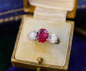 Downstairs at Grays: A three-stone Ruby & Diamond Engagement Ring in 18ct Yellow Gold, English, Circa 1970
