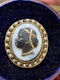 Victorian blackamoor brooch with a black enamel and natural pearl mount - image 2