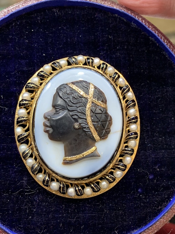 Victorian blackamoor brooch with a black enamel and natural pearl mount - image 2