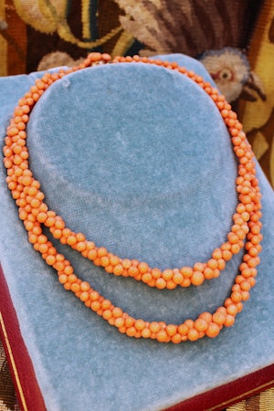 Downstairs at Grays: A natural Coral graduated double row necklace with a Coral and 9ct Yellow Gold Clasp, Circa 1940