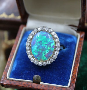 An Opal & DIamond Cluster Ring set in 14ct Yellow Gold & Silver, Continental, Circa 1905