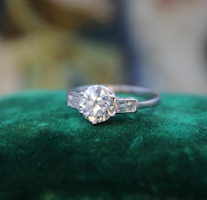 Downstairs at Grays: A Beautiful 1.04 Carat, Art Deco, Diamond Solitaire Engagement Ring, with Baguette-cut Diamond  Shoulders, set in Platinum.  Circa 1930