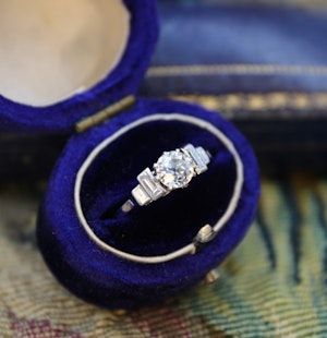 Downstairs at Grays: An Art Deco 0.73 Carat Diamond Engagement Ring, with Classic "Stepped" Diamond Shoulders, set in Platinum, English, Circa 1930