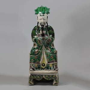 Chinese seated biscuit figure of a court official, Kangxi (1662-1722)