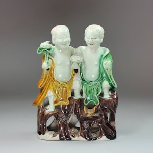 Chinese famille verte laughing twins 'HeHe Erxian' biscuit group, Kangxi (1662-1722)