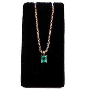 Emerald pendant on gold chain