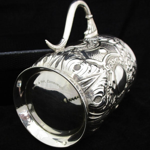A fine quality silver embossed mug. - image 8