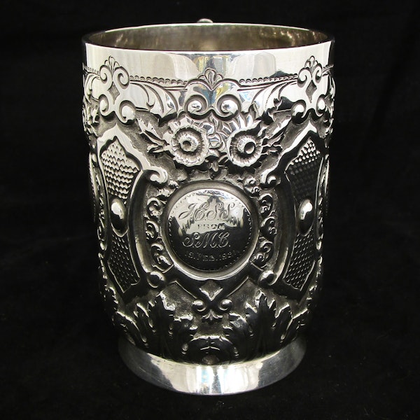 A fine quality silver embossed mug. - image 13