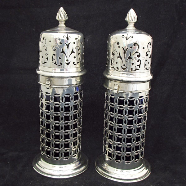 A rare pair of silver sugar shakers with blue liners. - image 2
