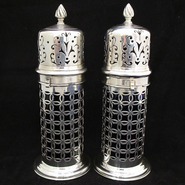 A rare pair of silver sugar shakers with blue liners. - image 4