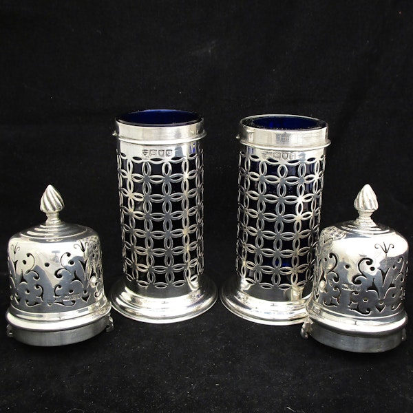 A rare pair of silver sugar shakers with blue liners. - image 5