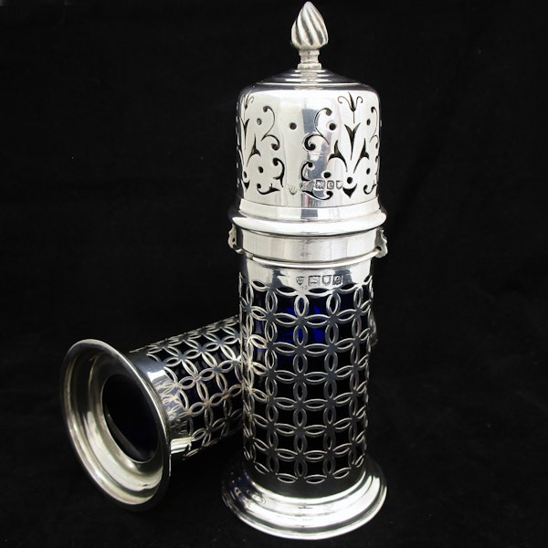A rare pair of silver sugar shakers with blue liners. - image 7