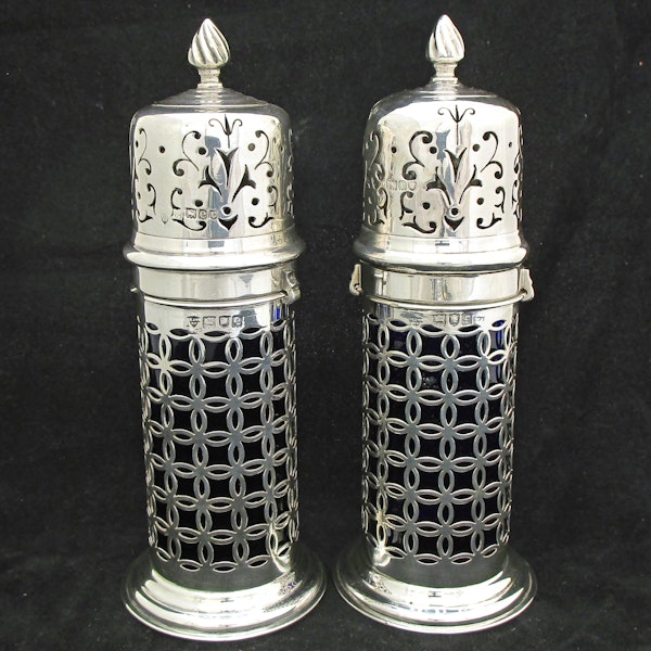 A rare pair of silver sugar shakers with blue liners. - image 1