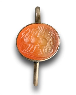 Georgian gold ring with an intaglio of Cupid in a chariot. Italian, 18th century