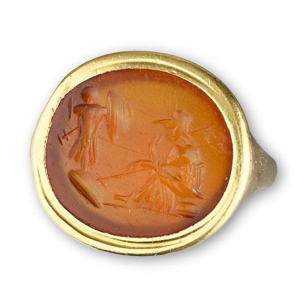 Gold ring with a Roman intaglio of a seated Minerva before a trophy of armour. - image 1