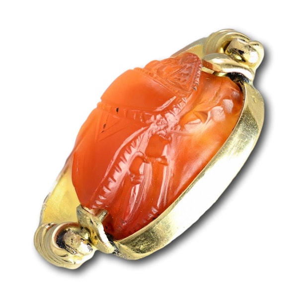 Gold ring with an Etruscan carnelian scarab of a figure carrying an amphora. - image 2