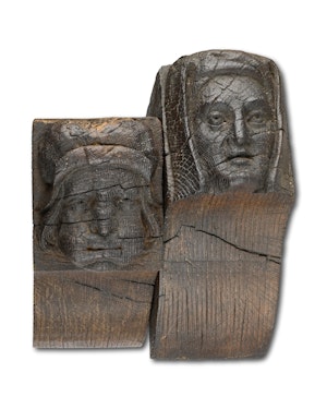 Fine pair of oak corbels of a man and a woman. English, 15th - 16th century.