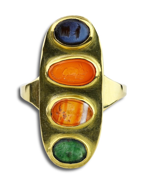 Gold ring set with four Ancient and Renaissance hardstone intaglios. - image 1